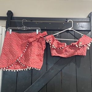 ASOS matching skirt/crop top set. Red with white pattern and Pom Pom details.